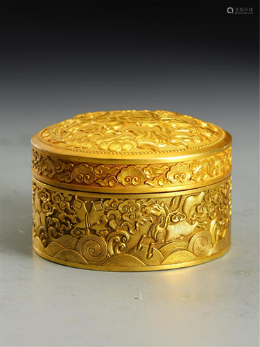 A BRONZE GILT CIRCULAR BOX AND COVER