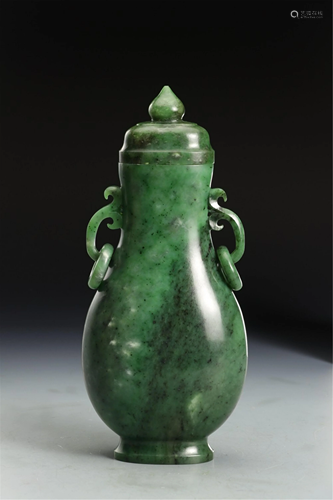 A CARVED JASPER VASE WITH COVER AND DOUBLE HANDLES