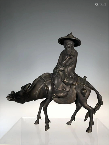 A BRONZE 'IMMORTAL RIDING A DONKEY' INCENSE BURNER