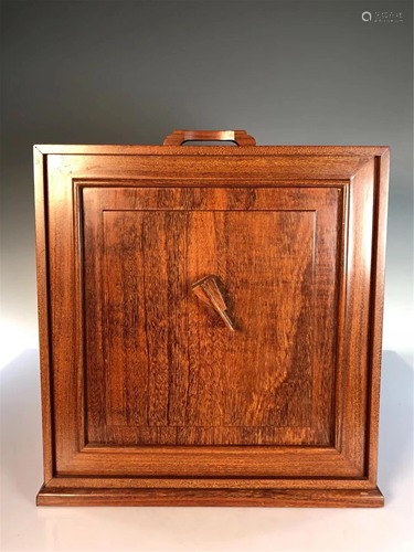 A HARDWOOD CARVED BOOK CASE