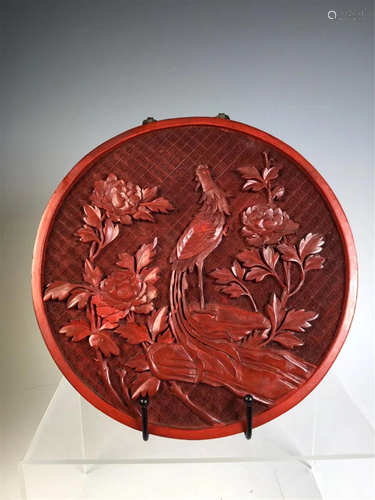 A CARVED RED LACQUER CIRCULAR HANGING SCREEN