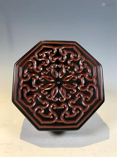 A CARVED LACQUER OCTAGONAL BOX AND COVER