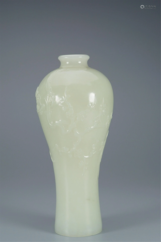 A WHITE JADE CARVED FLOWER AND BIRD VASE