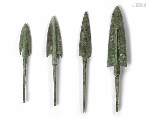 A GROUP OF FOUR BRONZE ARROWHEADS, ANCIENT NEAR EAST,