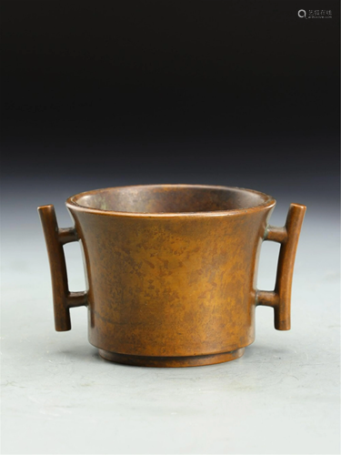 A TUBE SHAPED BRONZE CENSER WITH DOUBLE HANDLES