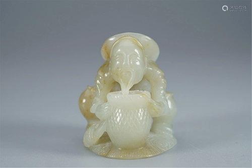 A WHITE JADE CARVING OF FISHER MAN