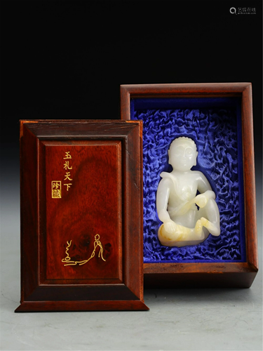 A WHITE JADE CARVED SEATED BUDDHA