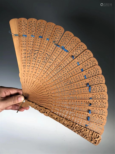 A HOLLOW CARVED WOODEN FOLDING FAN