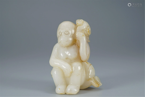 A WHITE JADE CARVING OF TWO MONKEYS