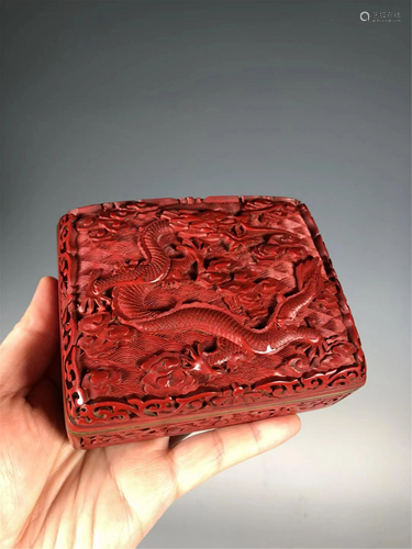 A CARVED RED LACQUER DRAGON BOX AND COVER