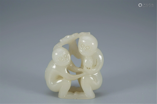 A JADE CARVING OF TWO MONKEYS AND PEACH