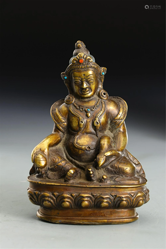 A GILT BRONZE SEATED YELLOW JAMBHALA