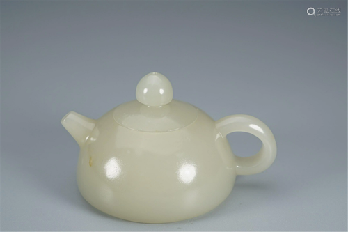 A CARVED WHITE JADE TEA POT