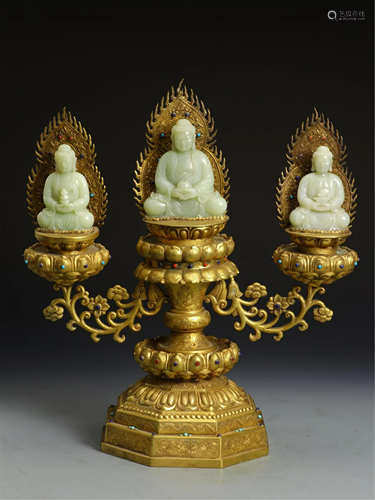 A TRIPLET JADE BUDDHA WITH GILT BRONZE PEDESTALS