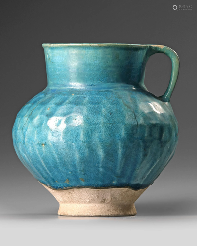 A TURQUOISE BLUE GLAZED POTTERY JUG, PERSIA-KASHAN,