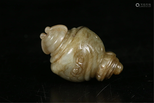 A CARVED JADE DHARMA CONCH