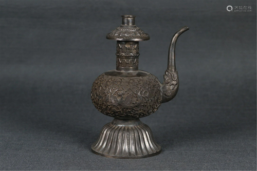 A CARVED SILVER WINE POT