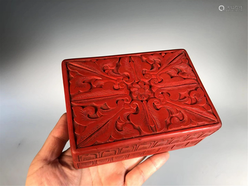 A CARVED RED LACQUER RECTANGULAR BOX AND COVER