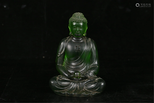 A GREEN GLASS SEATED MEDICINE BUDDHA