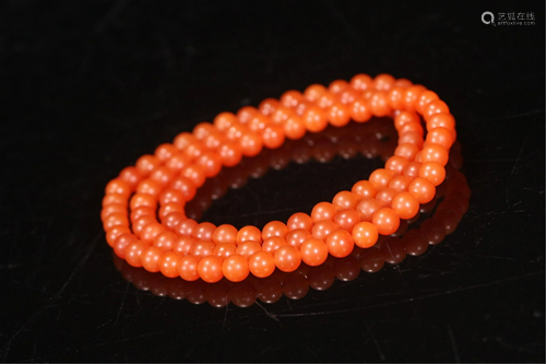 A STRING OF NANJIANG RED AGATE-BEAD NECKLACE