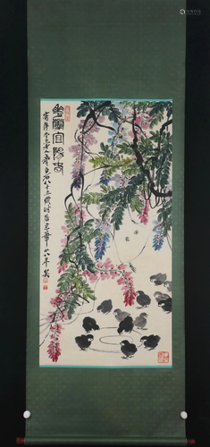 A CHINESE PAINTING OF CHICKS UNDER WISTERIA