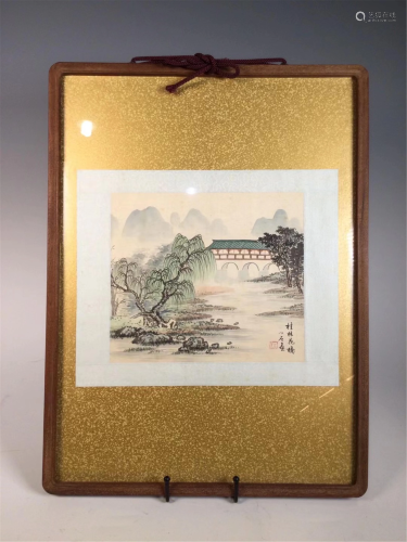 A FRAMED CHINESE LANDSCAPE PAINTING