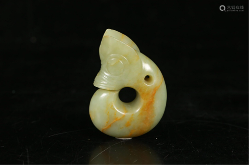 A JADE CARVED MYTHICAL BEAST PENDANT