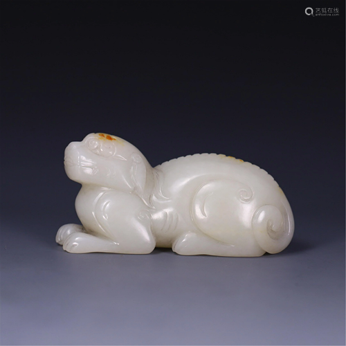 A MYTHICAL BEAST SHAPED JADE PAPERWEIGHT