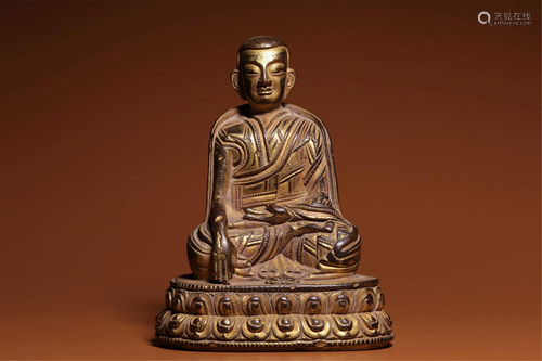 A BRONZE GILT SEATED GURU MARPA