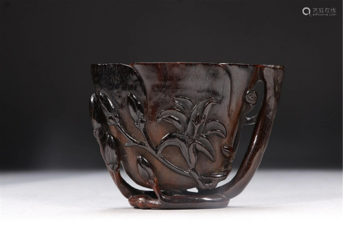 A GLASS CARVED FLORAL CUP