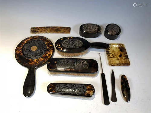 A SET OF TORTOISESHELL CARVED DRAGON CARING TOOLS