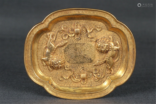 A GILT BRONZE PLATE WITH RELIEF LIONS AND BALLS