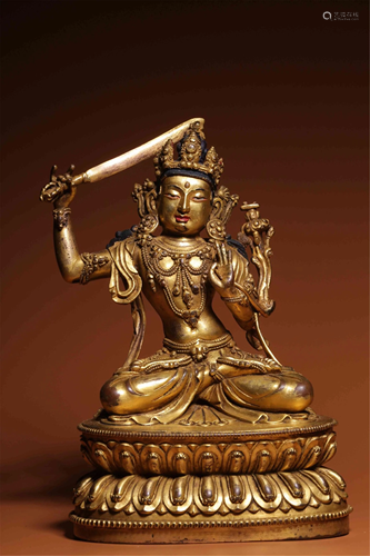 A BRONZE GILT SEATED MANJUSRI