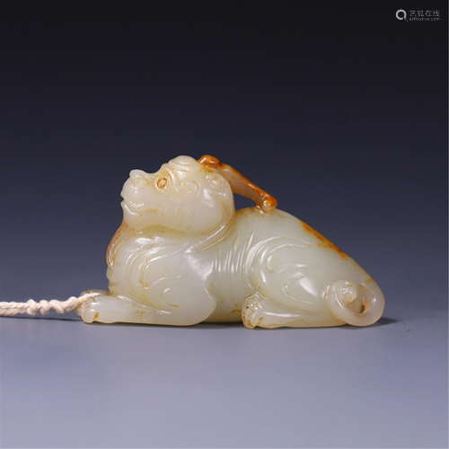 A MYTHICAL BEAST SHAPED JADE CARVING