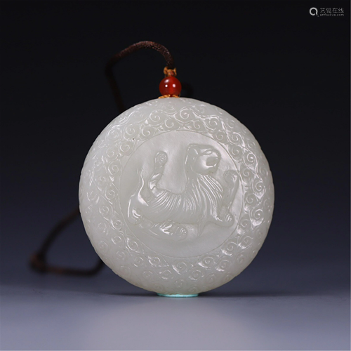 A JADE CARVED DRAGON AND TIGER CIRCULAR PENDANT