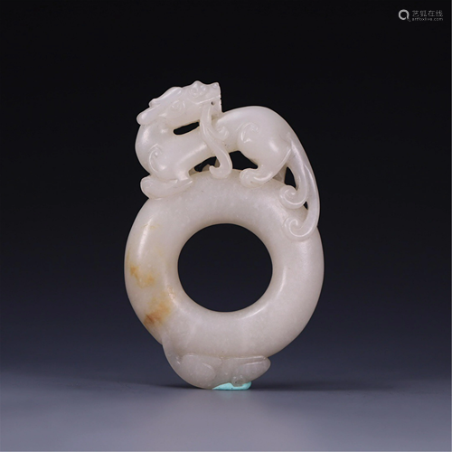 A JADE CARVED DRAGON PENDANT