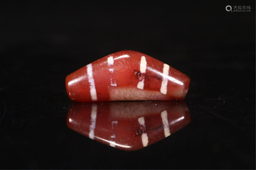 A HORN SHAPED AGATE DZI BEAD