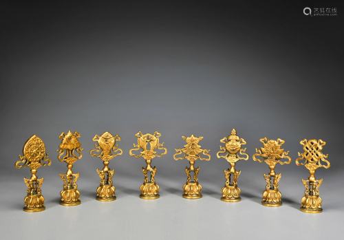 A Group of Eight Bronze Gilt Buddhist Auspicious Items