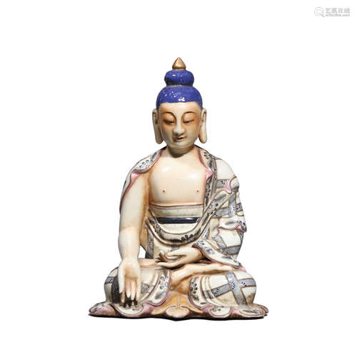 A Porcelain Figurine Of Shakyamuni