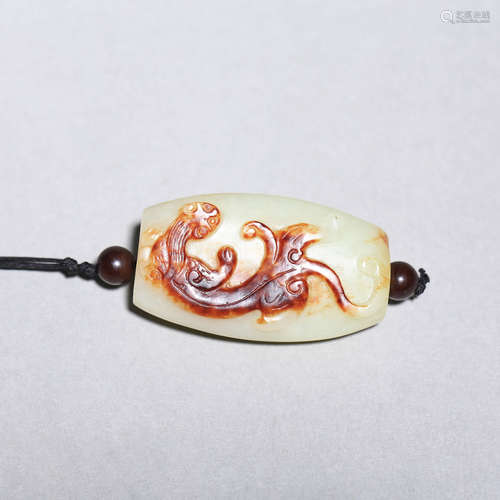 A Carved Jade Cameo Dragon Pendant