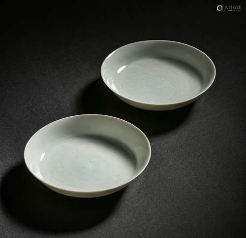 A PAIR OF CELADON PLATES FROM HUTIAN WARE, SOUTHERN SONG DYN...