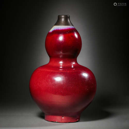 QING DYNASTY, A CHINESE RED-GLAZED GOURD VASE