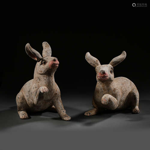 HAN DYNASTY, A PAIR OF CHINESE POTTERY RABBITS