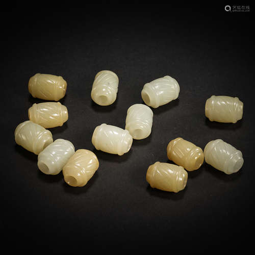 A GROUP OF HETIAN JADE BEADS, QING DYNASTY, CHINA