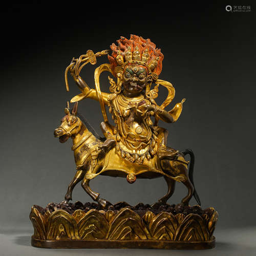 A GILT BRONZE STATUE OF THE GOD OF WEALTH, THE QING DYNASTY,...