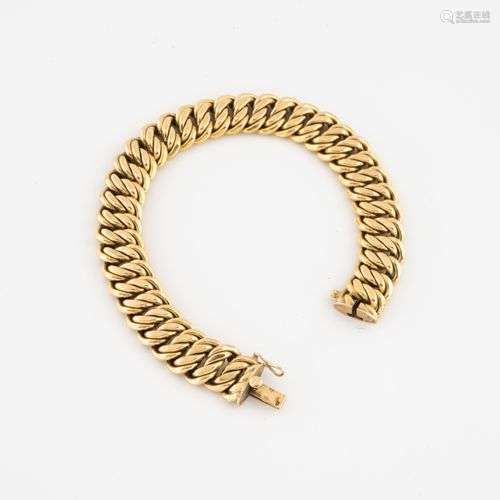 Bracelet gourmette en or jaune (750) à maille américaine. Fe...