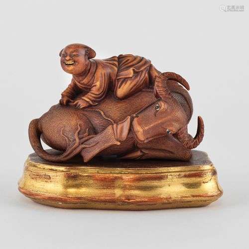 Enfant jouant avec un buffle, Japon, XXe s Bois sculpté, sig...