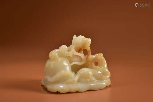 A HETIAN JADE CARVING OF BOY AND HORSE