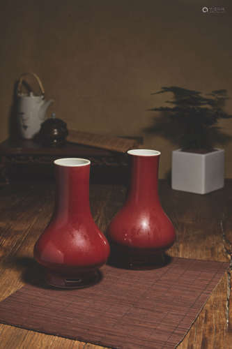 A PAIR OF ALTAR RED GLAZE INSCRIBED BOTTLE VASE