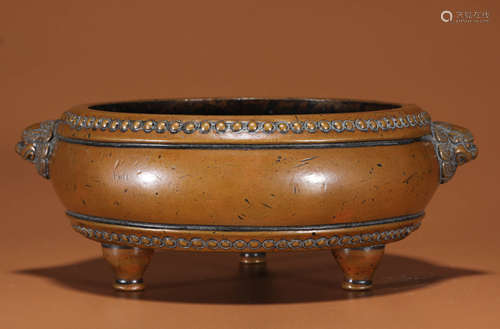 A BRONZE TRIPOD CENSER